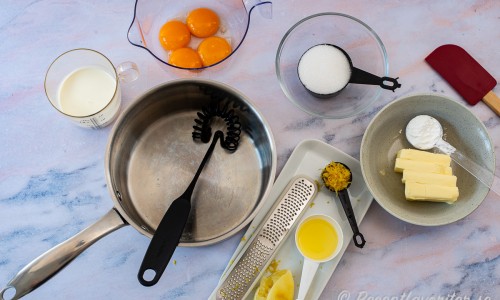 Ingredienser till krämen: grädde, äggulor, socker, smör, maizena, finrivet citronskal och färskpressad citron. 