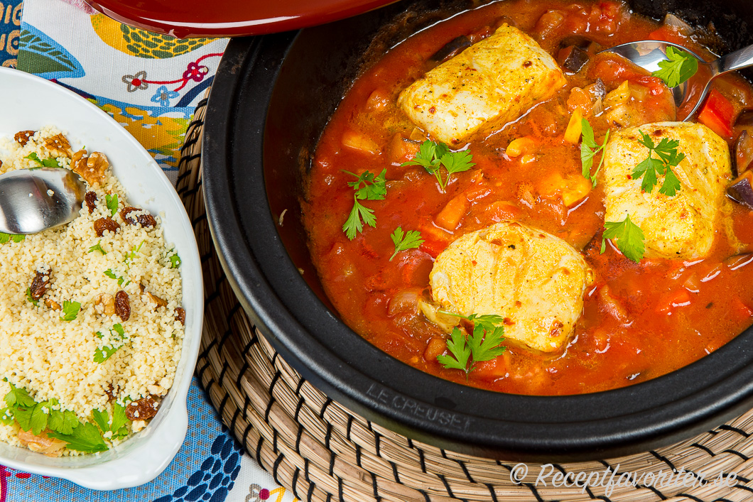 En tagine eller gryta med nordisk fisk tillagad på marockansk vis serverad med couscous. En tagine eller gryta med nordisk fisk tillagad på marockansk vis serverad med couscous.
